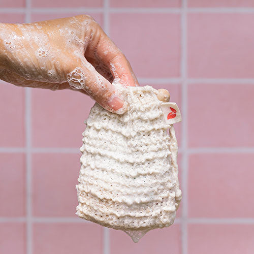 Shampoo and soap saver bag in use